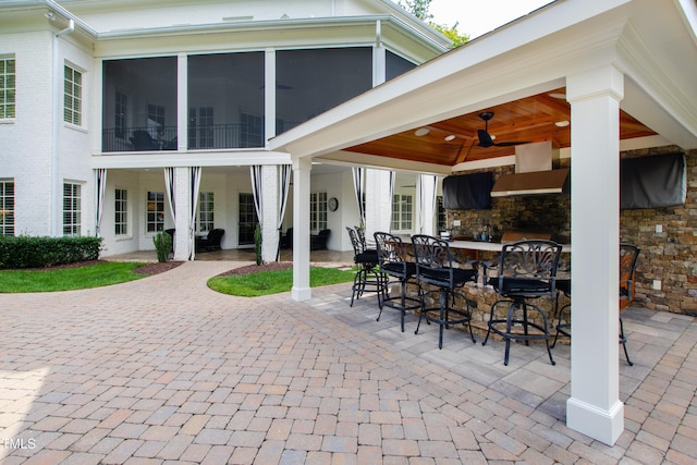 view of patio with outdoor dry bar