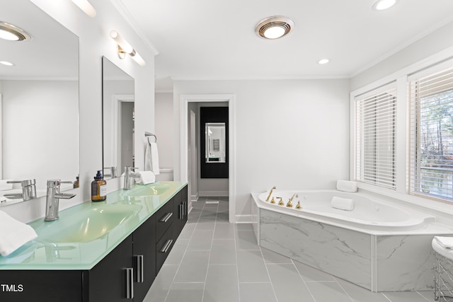 bathroom featuring tile patterned flooring, crown molding, and a sink