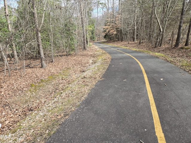 view of road featuring a view of trees