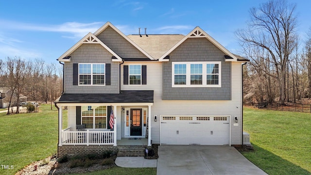 1318 Reading Ct, Burlington, NC 27217 - craftsman-style home featuring an attached garage, a front lawn, covered porch, and concrete driveway