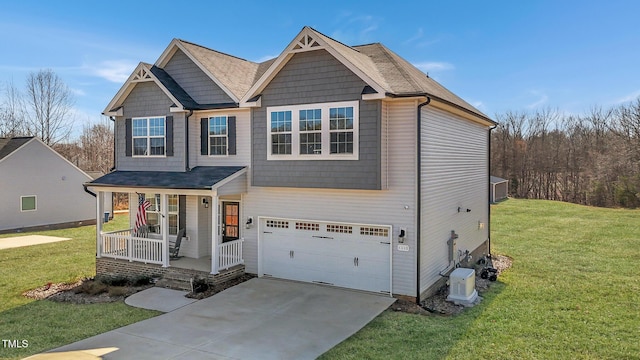 1318 Reading Ct, Burlington, NC 27217 - craftsman-style house featuring an attached garage, a porch, a front lawn, and driveway