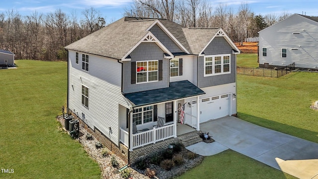 1318 Reading Ct, Burlington, NC 27217 - traditional-style home featuring driveway, covered porch, an attached garage, a shingled roof, and a front yard
