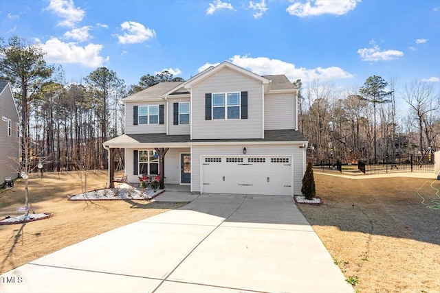 view of front facade with covered porch, driveway, and an attached garage