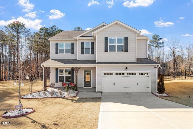 view of front facade featuring a porch, driveway, and an attached garage