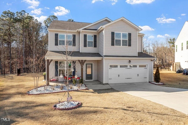 view of front of home with a porch, a front lawn, driveway, and a garage