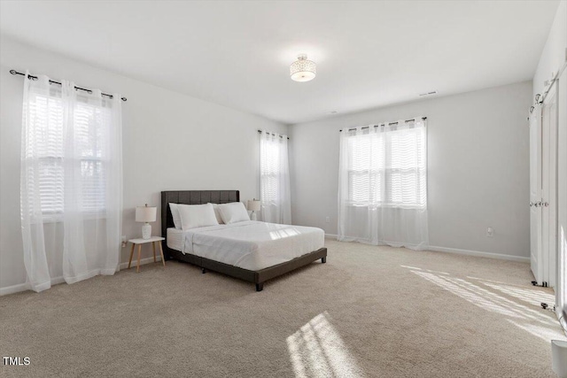 bedroom featuring carpet floors and baseboards