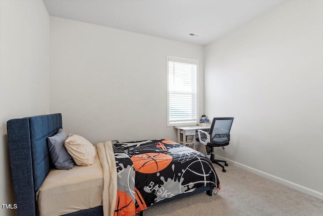 bedroom featuring carpet floors, visible vents, and baseboards