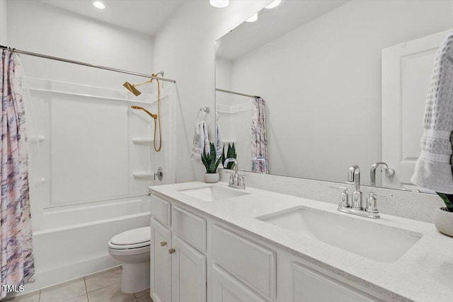 full bath featuring shower / bath combo with shower curtain, a sink, toilet, and tile patterned floors