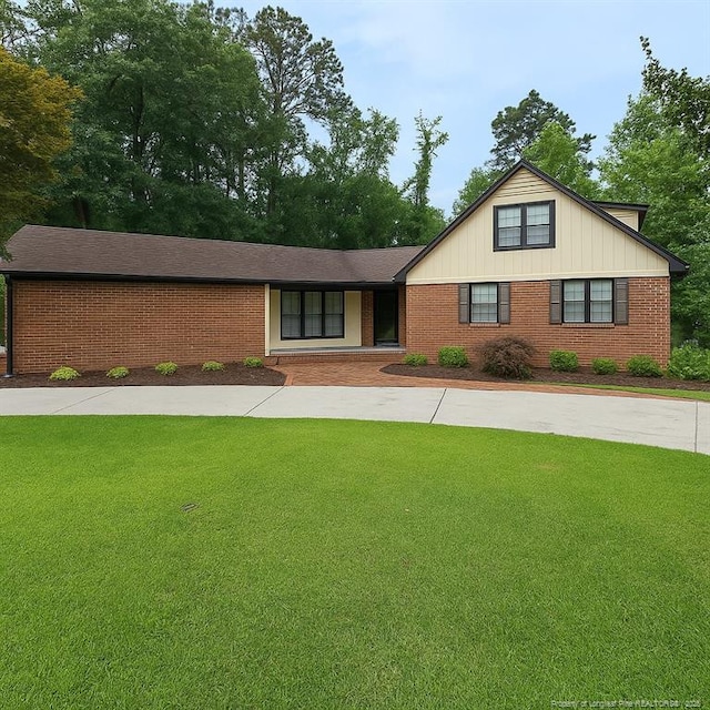 1855 Riverside Blvd, Lumberton, NC 28358 - view of front of house featuring a front yard and brick siding
