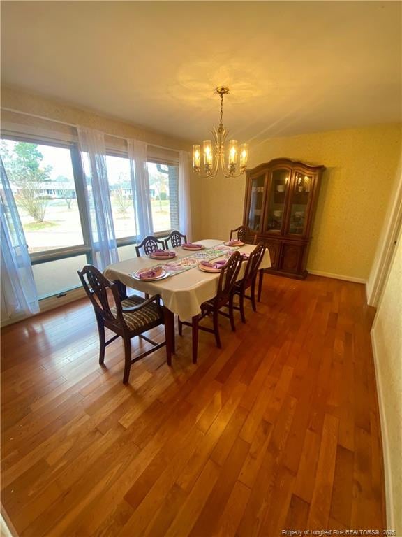 1855 Riverside Blvd, Lumberton, NC 28358 - dining area featuring a chandelier and light wood-style flooring