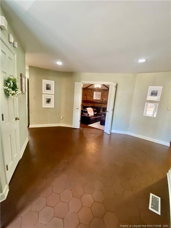 1855 Riverside Blvd, Lumberton, NC 28358 - unfurnished living room with recessed lighting and baseboards