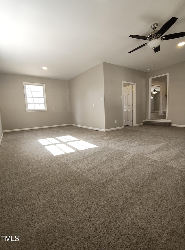 empty room featuring ceiling fan, recessed lighting, carpet, and baseboards