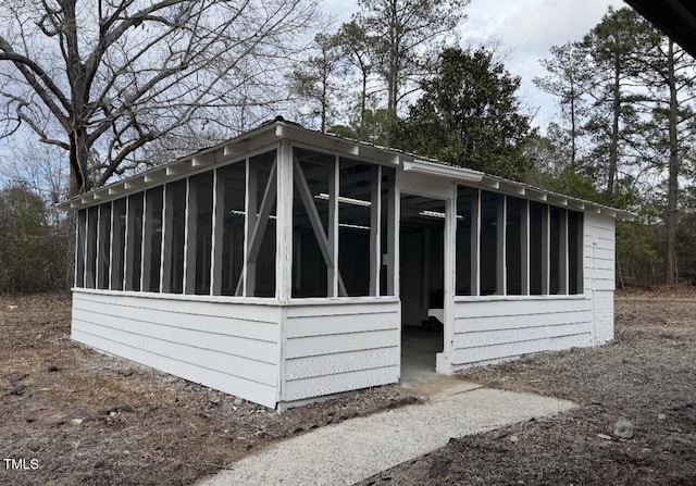 view of side of home with a sunroom