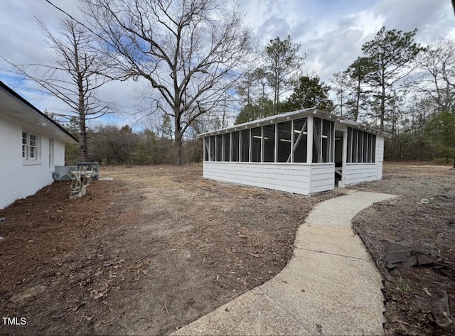 view of side of property with a sunroom