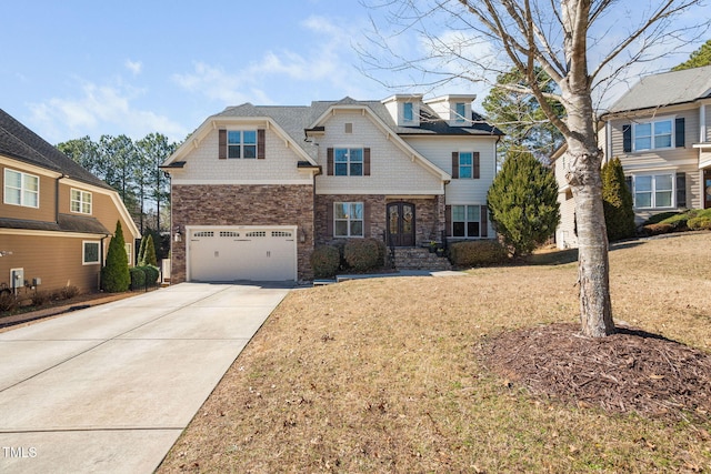 view of front of home featuring a front yard, a garage, and driveway