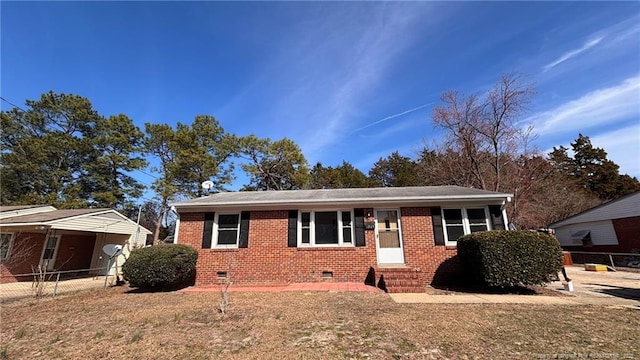 view of front facade featuring entry steps, crawl space, brick siding, and fence