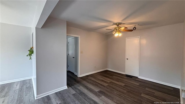 1809 Wayne Ln, Fayetteville, NC 28304 - unfurnished room featuring ceiling fan, dark wood-type flooring, and baseboards