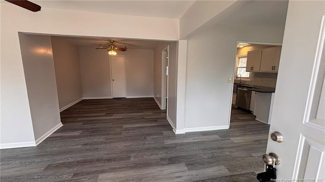 1809 Wayne Ln, Fayetteville, NC 28304 - unfurnished dining area with a ceiling fan, a sink, dark wood finished floors, and baseboards