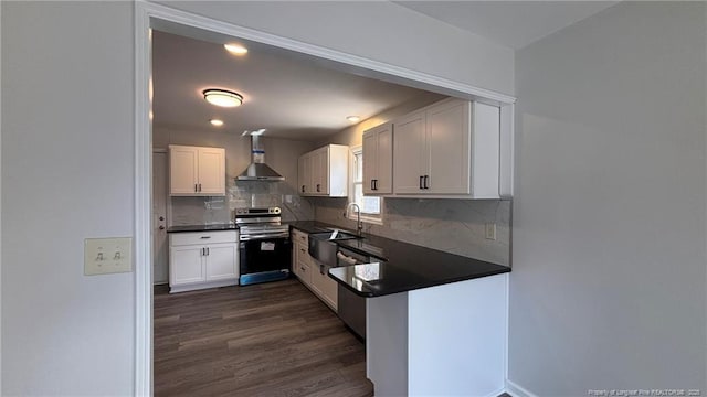 1809 Wayne Ln, Fayetteville, NC 28304 - kitchen with stainless steel appliances, white cabinets, decorative backsplash, dark wood-style floors, and dark countertops