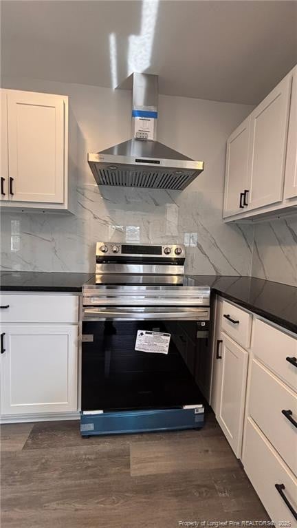 1809 Wayne Ln, Fayetteville, NC 28304 - kitchen featuring decorative backsplash, dark countertops, ventilation hood, and stainless steel electric stove