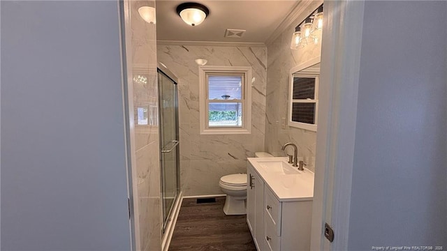 1809 Wayne Ln, Fayetteville, NC 28304 - bathroom featuring toilet, wood finished floors, vanity, ornamental molding, and a shower stall
