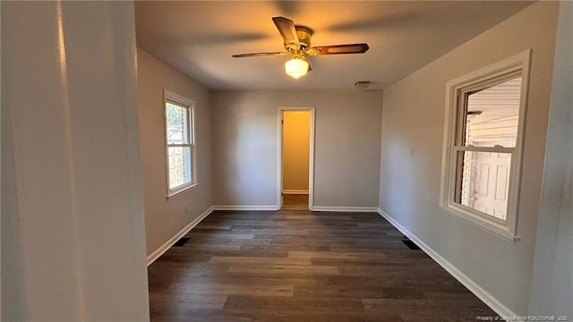 1809 Wayne Ln, Fayetteville, NC 28304 - unfurnished room featuring dark wood-style flooring, a ceiling fan, and baseboards