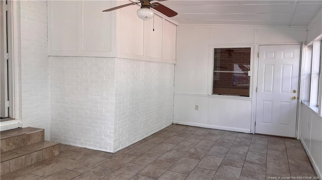 1809 Wayne Ln, Fayetteville, NC 28304 - unfurnished room featuring brick wall and a ceiling fan