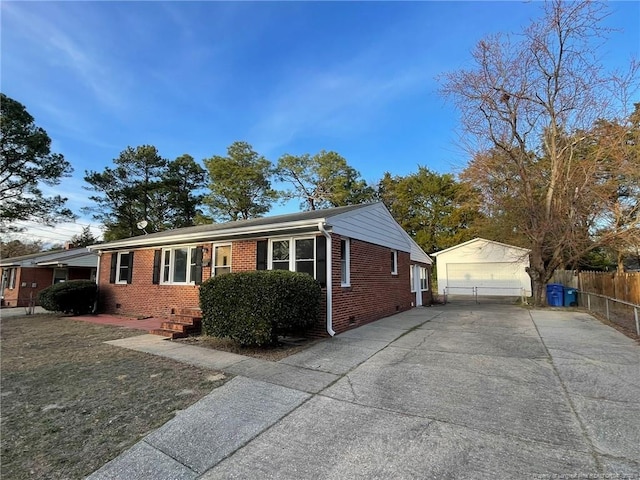 1809 Wayne Ln, Fayetteville, NC 28304 - view of front of house featuring an outbuilding, crawl space, brick siding, and fence