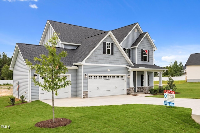 432 E Clydes Point Way, Wendell, NC 27591 - view of front of property featuring concrete driveway, a front lawn, a porch, roof with shingles, and stone siding