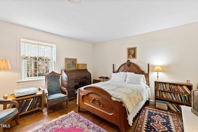 bedroom with wood finished floors