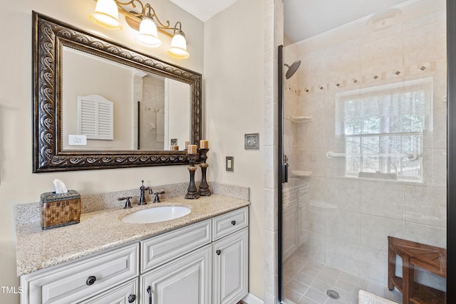 bathroom with a stall shower and vanity