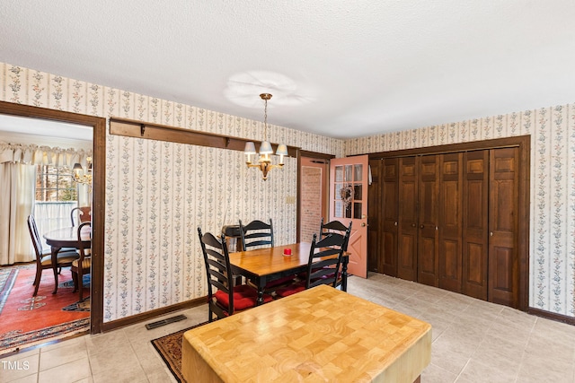 dining area with baseboards and wallpapered walls