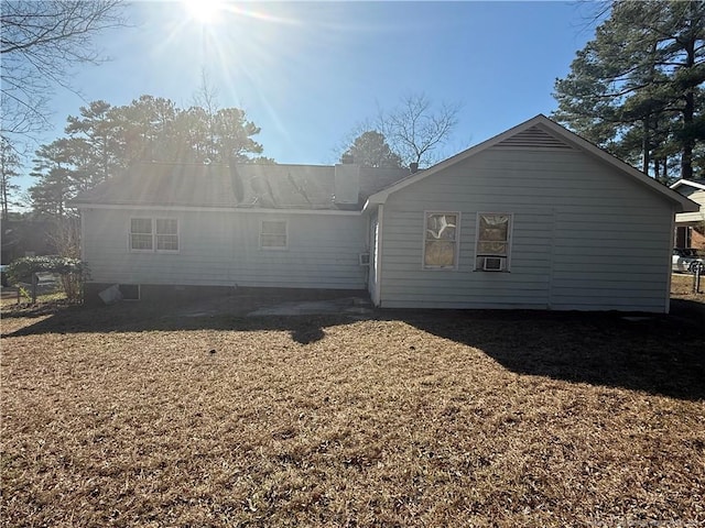 rear view of property with cooling unit