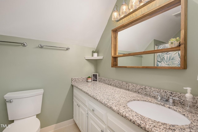 bathroom with toilet, visible vents, vanity, vaulted ceiling, and baseboards