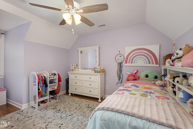 bedroom featuring vaulted ceiling, ceiling fan, wood finished floors, and visible vents