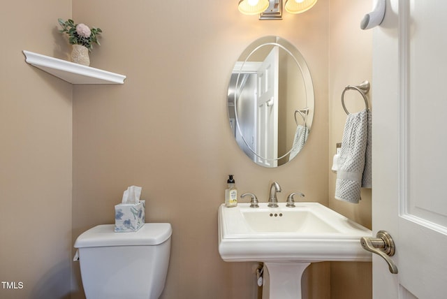 bathroom with a sink and toilet