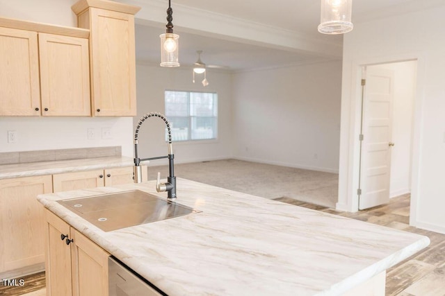 kitchen featuring a sink, ceiling fan, ornamental molding, and light brown cabinets