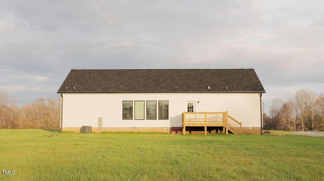 back of house featuring crawl space, a yard, a deck, and central AC unit