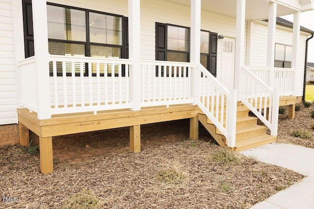 wooden terrace featuring covered porch