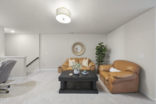 living room with light carpet and baseboards