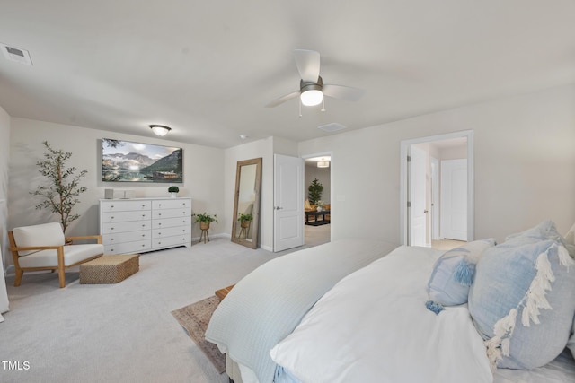 bedroom with carpet floors, visible vents, and a ceiling fan