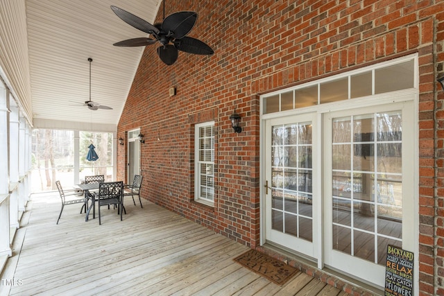 deck featuring ceiling fan and outdoor dining area