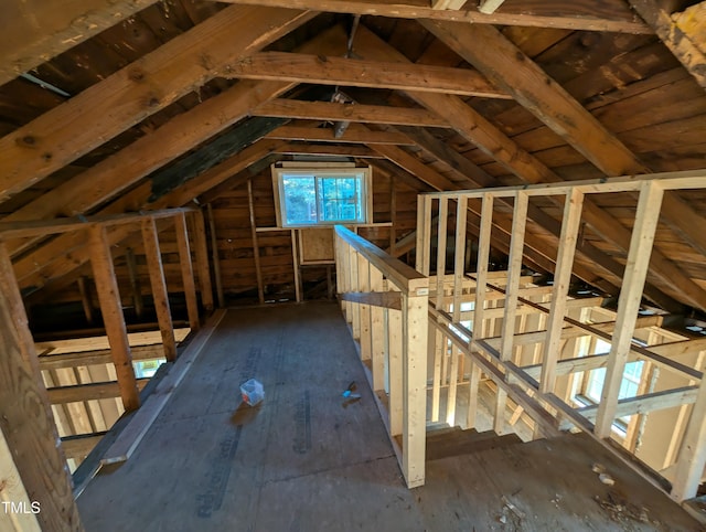 attic featuring an upstairs landing