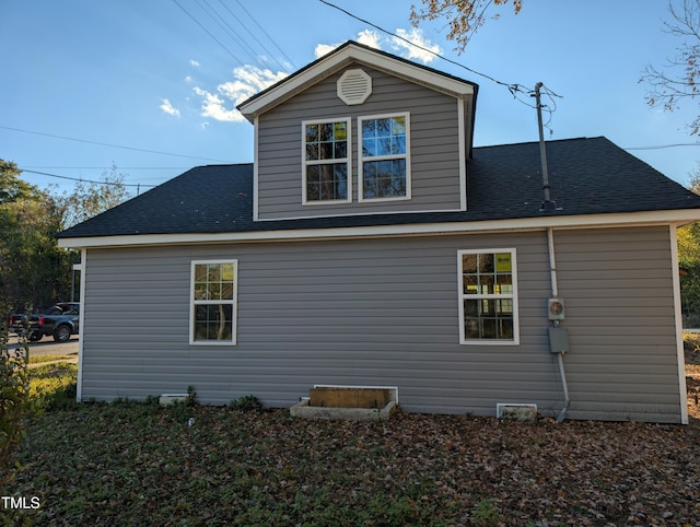 view of home's exterior featuring a shingled roof