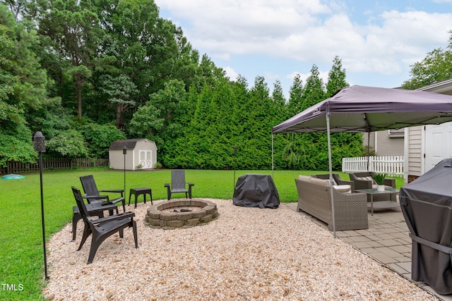 533 E Maple Ave, Holly Springs, NC 27540 - view of patio / terrace with an outdoor living space with a fire pit, a storage unit, a gazebo, and grilling area