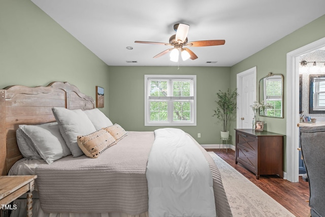 533 E Maple Ave, Holly Springs, NC 27540 - bedroom featuring dark wood-type flooring and a ceiling fan