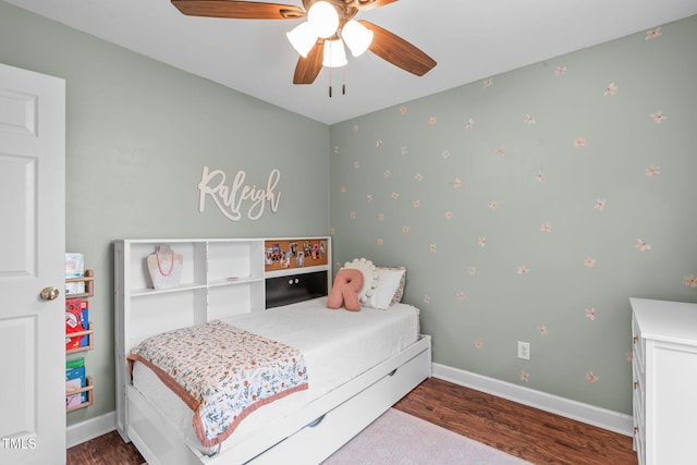 533 E Maple Ave, Holly Springs, NC 27540 - bedroom with wood finished floors and ceiling fan