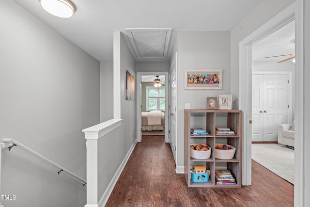 533 E Maple Ave, Holly Springs, NC 27540 - hall featuring attic access, an upstairs landing, and wood finished floors