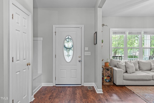 533 E Maple Ave, Holly Springs, NC 27540 - foyer entrance with dark wood-style flooring and baseboards