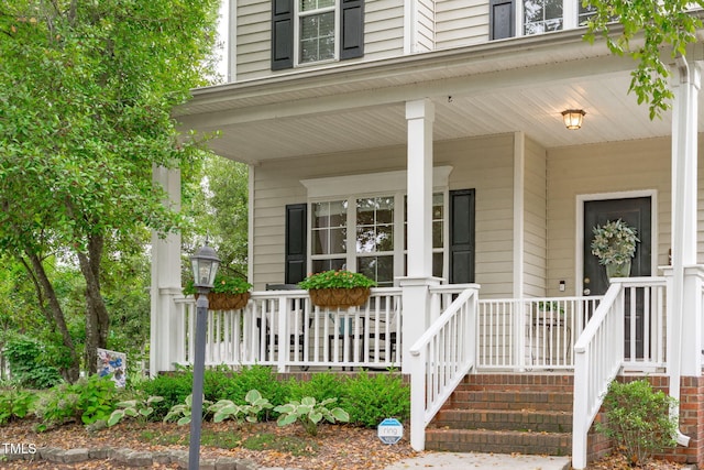 533 E Maple Ave, Holly Springs, NC 27540 - view of exterior entry featuring a porch